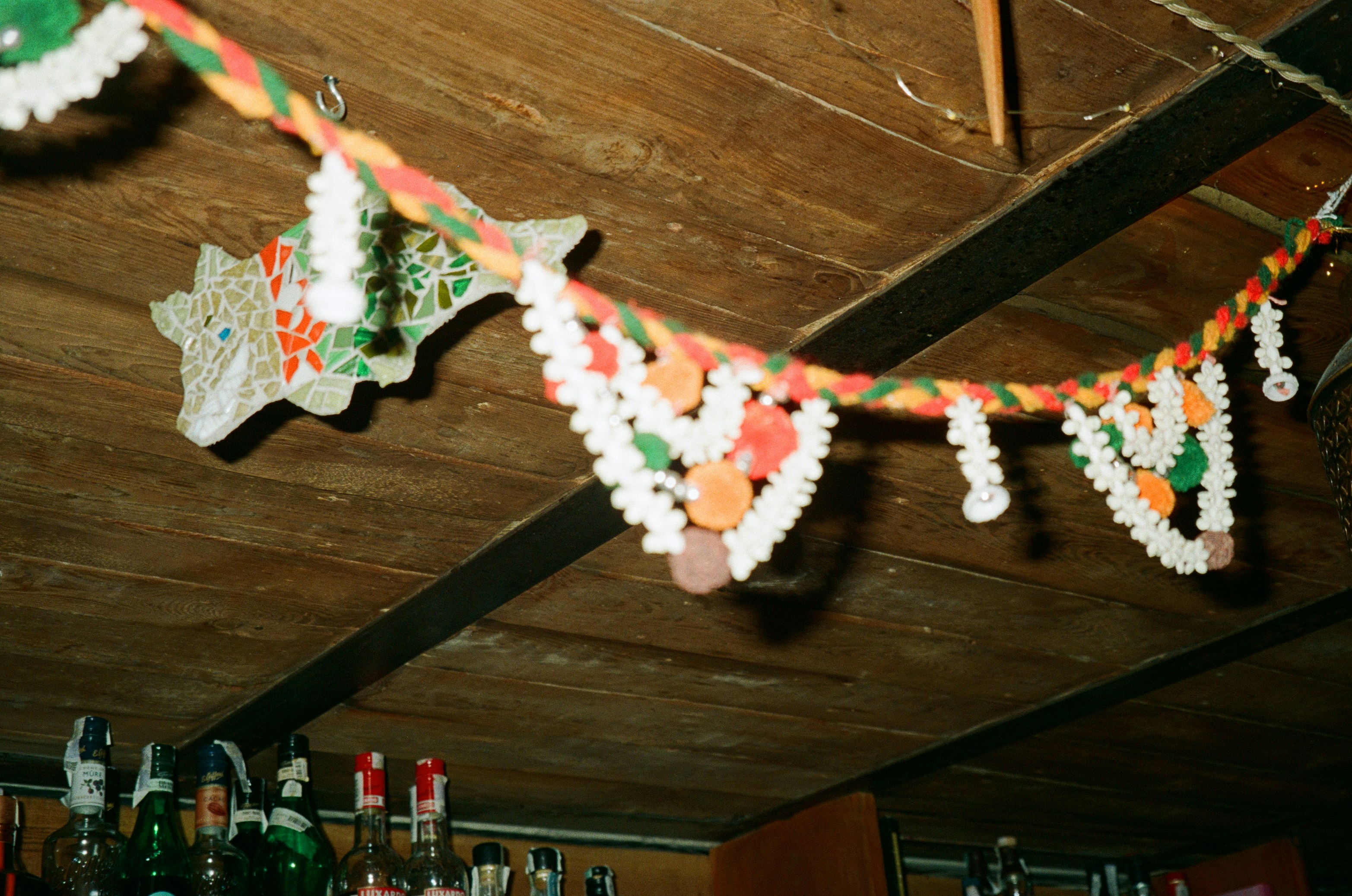A string of paper decorations hanging from a ceiling